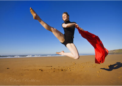 leaping high,dyamic,red,seaside,ballerina,dance,jump,dancer,flexibility,energy,leisure,young,training,sport,fashion,people,woman,girl,cool,style,movement,caucasian,skill,active,motion,performance,contemporary,modern,female,outside,action,fitness,sporty,fit,activity,youth,human,outdoor,dancers,grace,ballerina,theatrical,ballet,sand