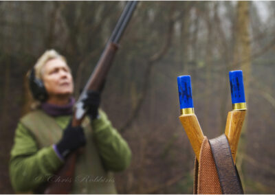 woman shooting,shotgun,cartridges,12 bore,V stick,countryside,country sport,blood sport,pheasant shooting,outdoors