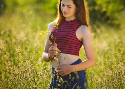 meadow; field; sun; sunny; evening; grass; smile; beautiful; female; casual; woman; girl; teen; attractive; young; natural; background; person; portrait; pretty; positive; model; youth; beauty; student; happiness; cheerful; happy; teenager; natural; Caucasian; one; joy; standing; lovely; bright; stylish; single; people; young adult; outdoors; outside; teenage; university student