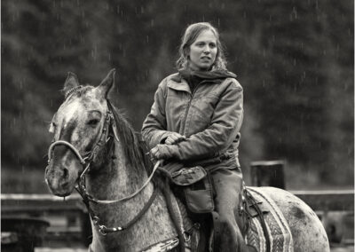 girl, horse, woman, young, sport, animal, female, outdoor, rider, horseback, lifestyle, people, ride, beautiful, saddle, person, attractive, equestrian, activity, rural, hobby, horseback riding, horse riding, riding, ranch, outside, equine, teenager, healthy, 20-25, american, caucasian, sitting, women, action, wrangler, rain, raining, wet