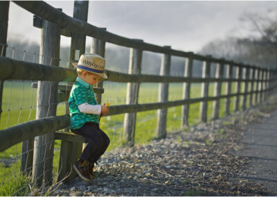 boy,sitting,spring,lifestyle,innocent,poster,rule of thirds,adorable,angel,beautiful,Caucasian,child,childhood,cute,emotion,emotions,fence,health,holding,flower,human,infant,kid,kids,little,look,love,outdoor,outdoors,outside,people,play,playing,portrait,pretty,small,sweet,toddler,wood,young,innocence,Devon,concentration,thinking