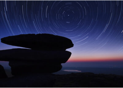 Star trails,Rough Tor,Bodmin moor,Cornwall,UK,dark,Stars,creative,Revolving,Rotating,night,rocks,revolving planet,swirling,moor,moors,night sky,night photography,timed exposure,bulb setting,travel.,Star,Sky,revolve,Rotate,pano,panoramic,panorama,advertise,advertisement,showery tor,Bodmin moor