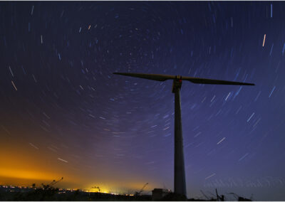 star trail,Wind Turbine,windmill,night sky,pole star,slow,shutter,speed,clean,energy,green,energy,environment,light,pollution,street,lights,Cornwall,landmark,towering,renewable energy,wind power,blades