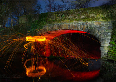 creating; light painting; images; created; create; imagery; artistic; digital photograph; light; lights; slow camera shutter speed; long exposure; open shutter; bulb; traditional light painting; illuminate; light drawing; color; colour; colourful; colorful; bridge; night; nighttime; fire; fire wheel; sparks